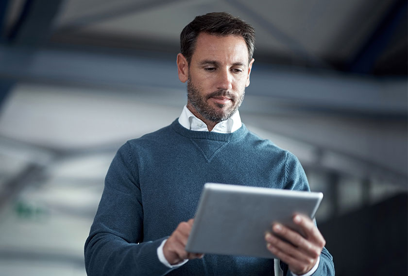 Man-with-iPad-in-Office - MCAA